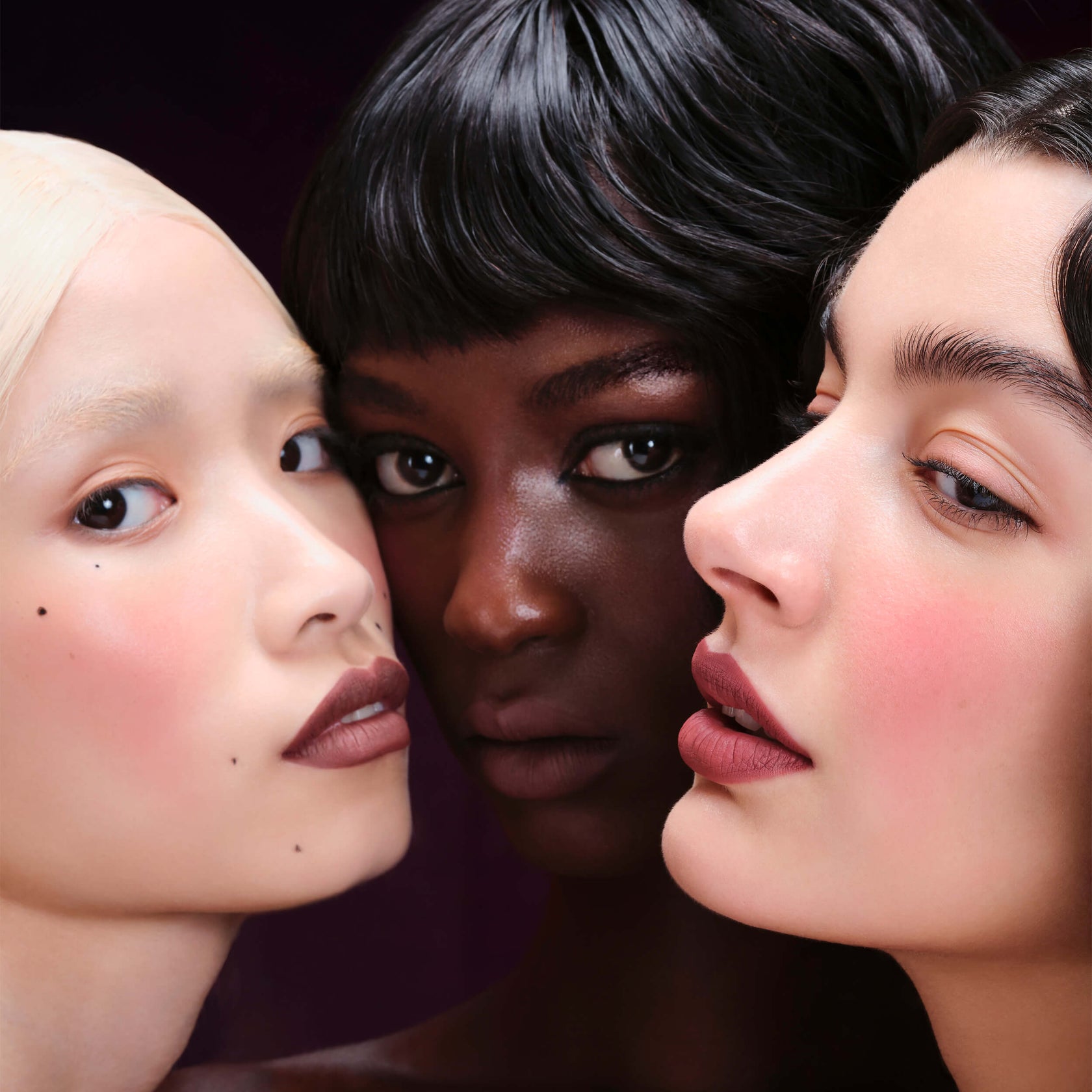 Kylie Cosmetics product showcase with bold makeup look